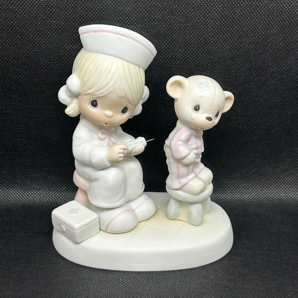 Precious Moments "Love Beareth All Things" figurine